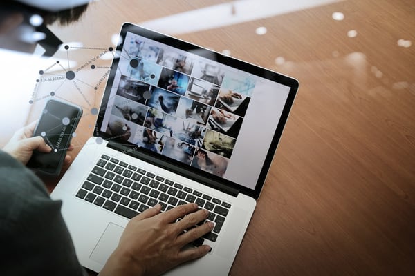 top view of businessman hand working with new modern computer and smart phone and business strategy on wooden desk with social media network as concept